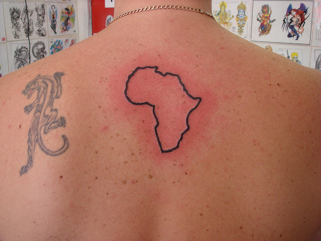 African outline map tattoo on back