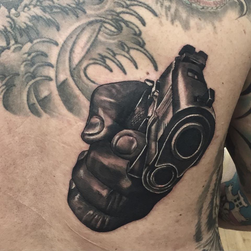 Amazing Pistol Tattoo Done by Artby Adem at Fat Fugu Tattoo Studio with radiantcolorsink - killerinktattoo
