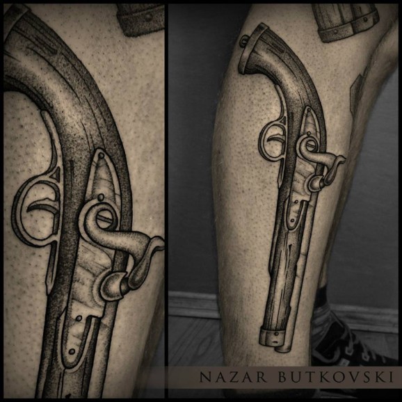Awesome Black and Grey Pistol Tattoo On Leg By Nazar Butkovsky