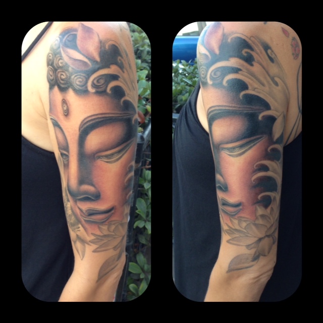 Awesome Buddha Tattoo on arm done by Tomas Archuleta