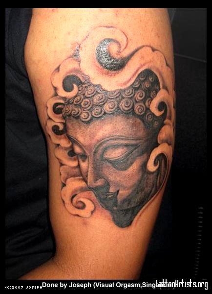 Awesome Buddha tattoo on bicep