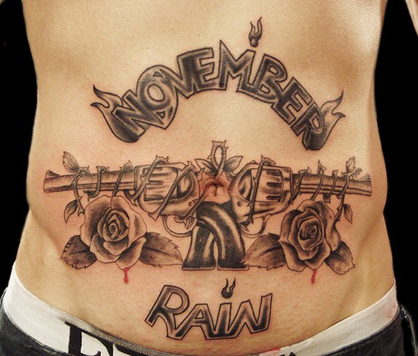 Awesome November Rain Crossed Guns and Roses Tattoo On Stomach