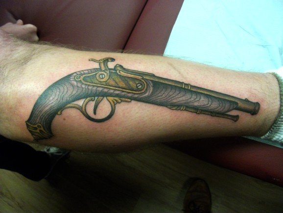 Awesome Old Pistol Tattoo On Forearm