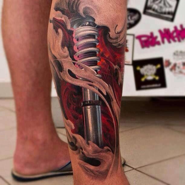 Awesome Shock Absorber and Biomechanical Tattoo On leg by Joe Bradshaw