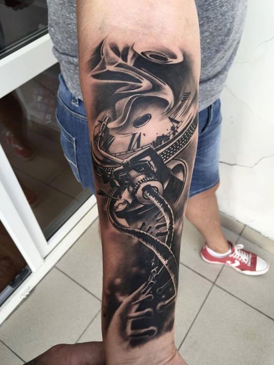 Awesome bio-mechanical tattoo on arm by Eduard