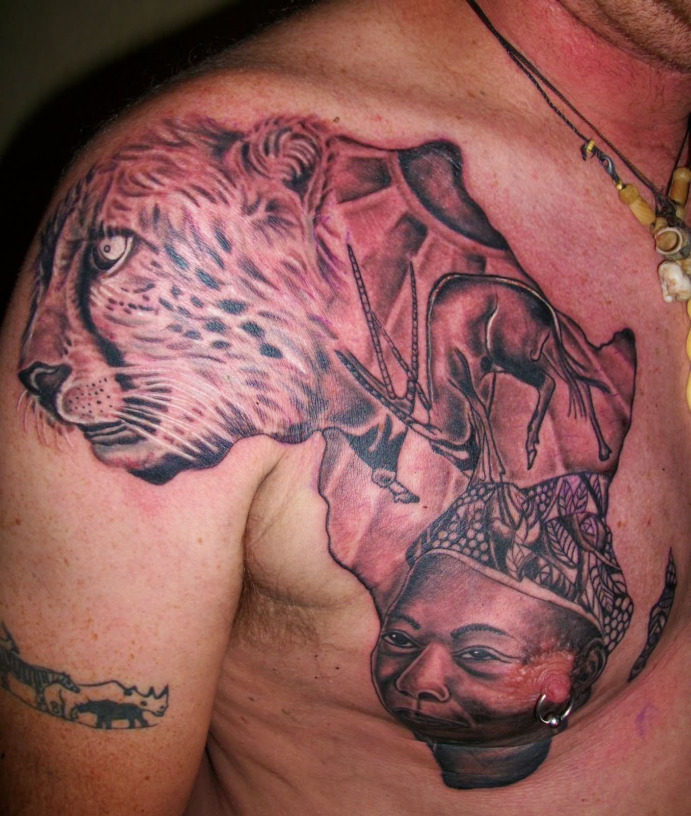 Awesome tiger's face, deer and african lady in African continent map tattoo on chest representing African life