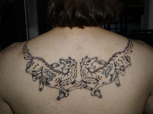Awesome wolf couple tattoo on upper back