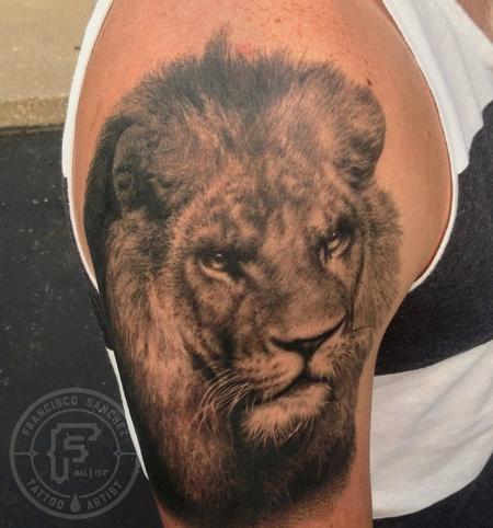 Black and grey realistic lion tattoo on half sleeve by Francisco Sanchez