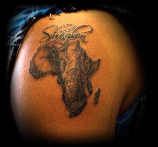 Black ink elephant face and trunk in African map tattoo