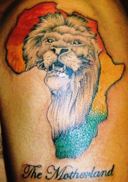 Black ink lion face in colorful african map with text The Motherland tattoo