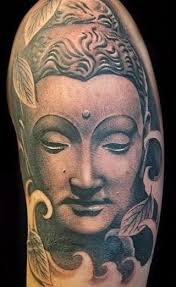 Buddha face tattoo on half sleeve