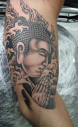 Buddha praying tattoo on arm