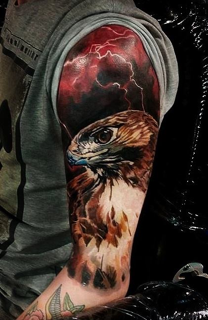 Colorful Eagle with lightning clouds tattoo on sleeve