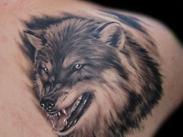 Cruel & Cunning symbol evil looking wolf tattoo