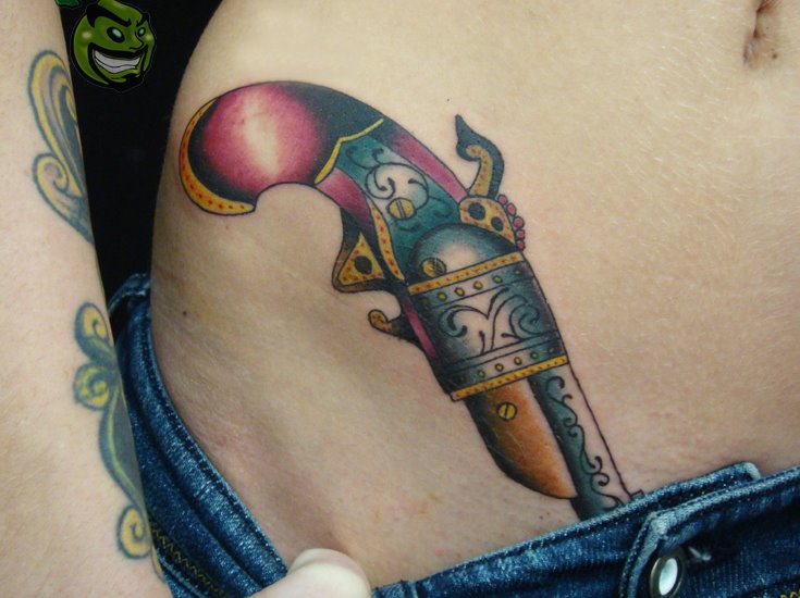 Cute colorful pistol tattoo on hip