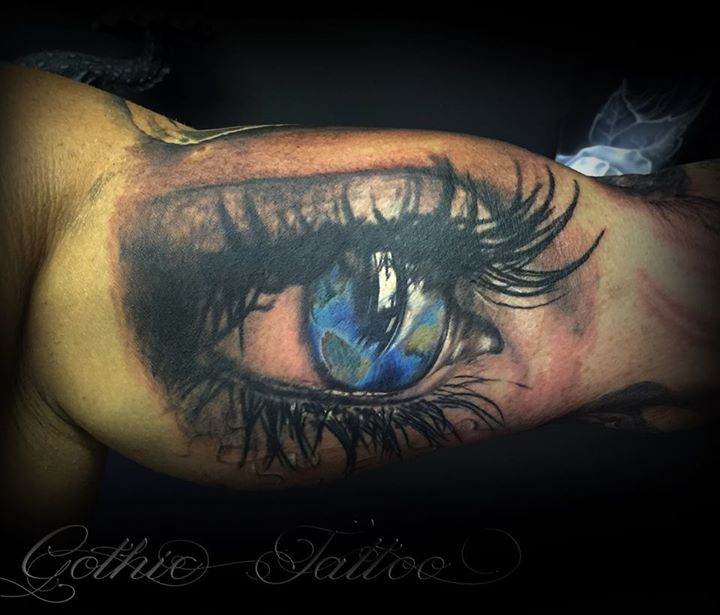 Eye tattoo on bicep by Gothic Tattoo