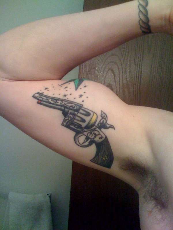 Firing Pistol Tattoo On Bicep Tattoo