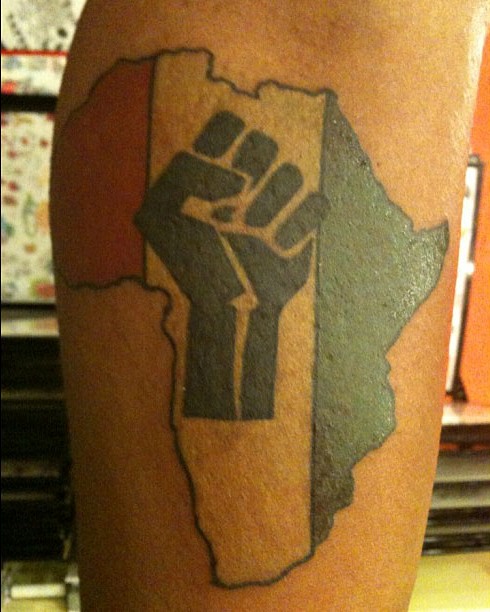 Flag in African map tattoo