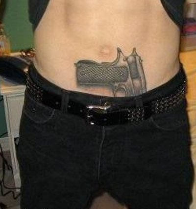 Grey Inked Pistol Tattoo On Waist