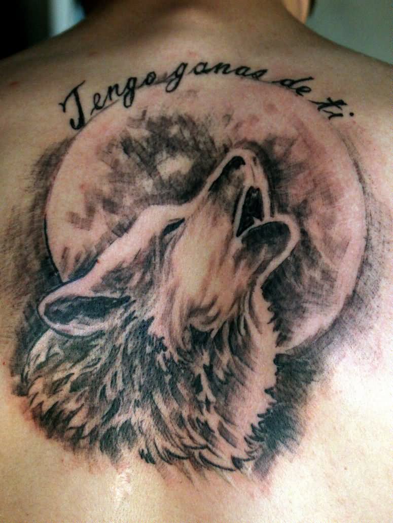 Howling Wolf at full moon tattoo on upper back