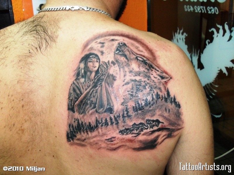 Howling wolf at moon in forest with Indian girl tattoo on shoulder back