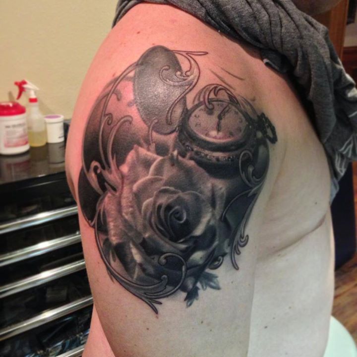 Rose and pocket watch tattoo on shoulder by Francisco Sanchez
