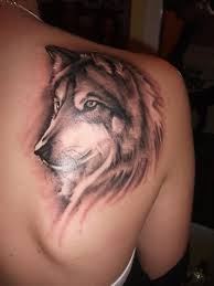 Sharp calm & composed watercolor wolf Tattoo on upper back