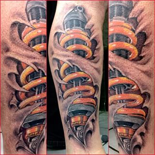 Shock absorber tattoo on leg by Ray Hunt