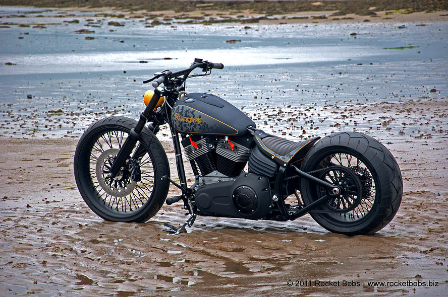 Side View Of Custom Harley Davidson Rocker C At Beach