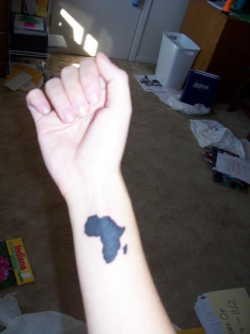 Small Black Ink African Map Tattoo On Wrist