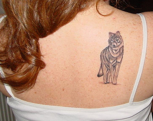 Standing Wolf Tattoo On Girl's Back
