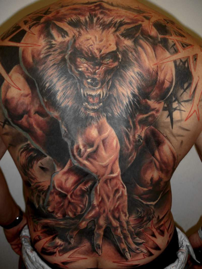 Wild wolf showing strength snd power tattoo on full back