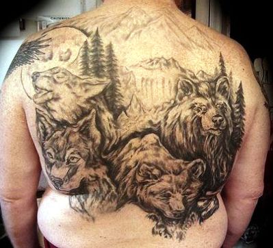 Wolves family and full moon tattoo on back representing unity in family