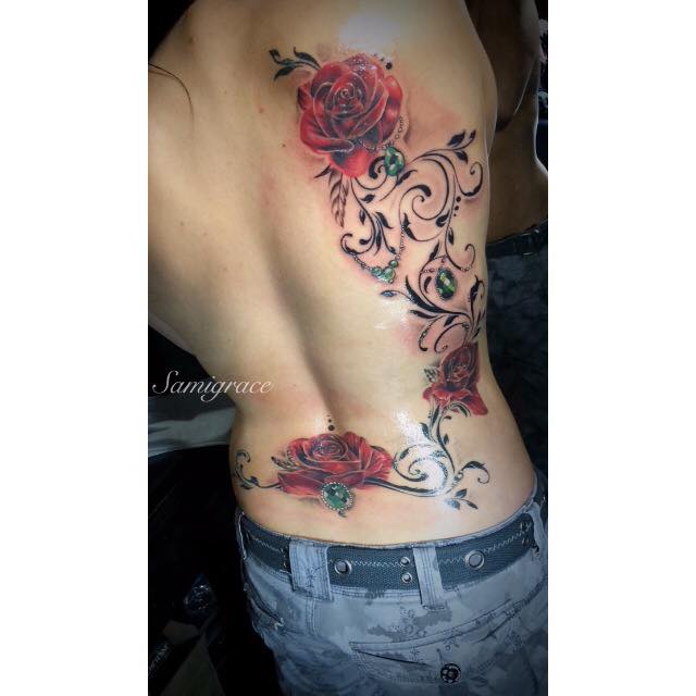 Awesome roses with branches and leaves tattoo on full back