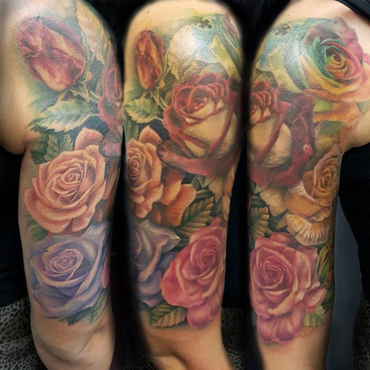 Beautiful rose flowers tattoo on half sleeve by Samm Lacey