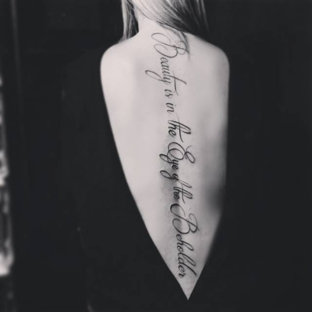 Beauty is in the eyes of the beholder - Lettering Tattoo on Back
