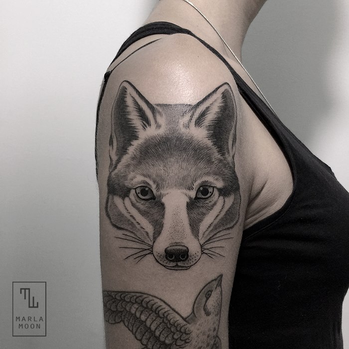 Black & white fox tattoo on shoulder