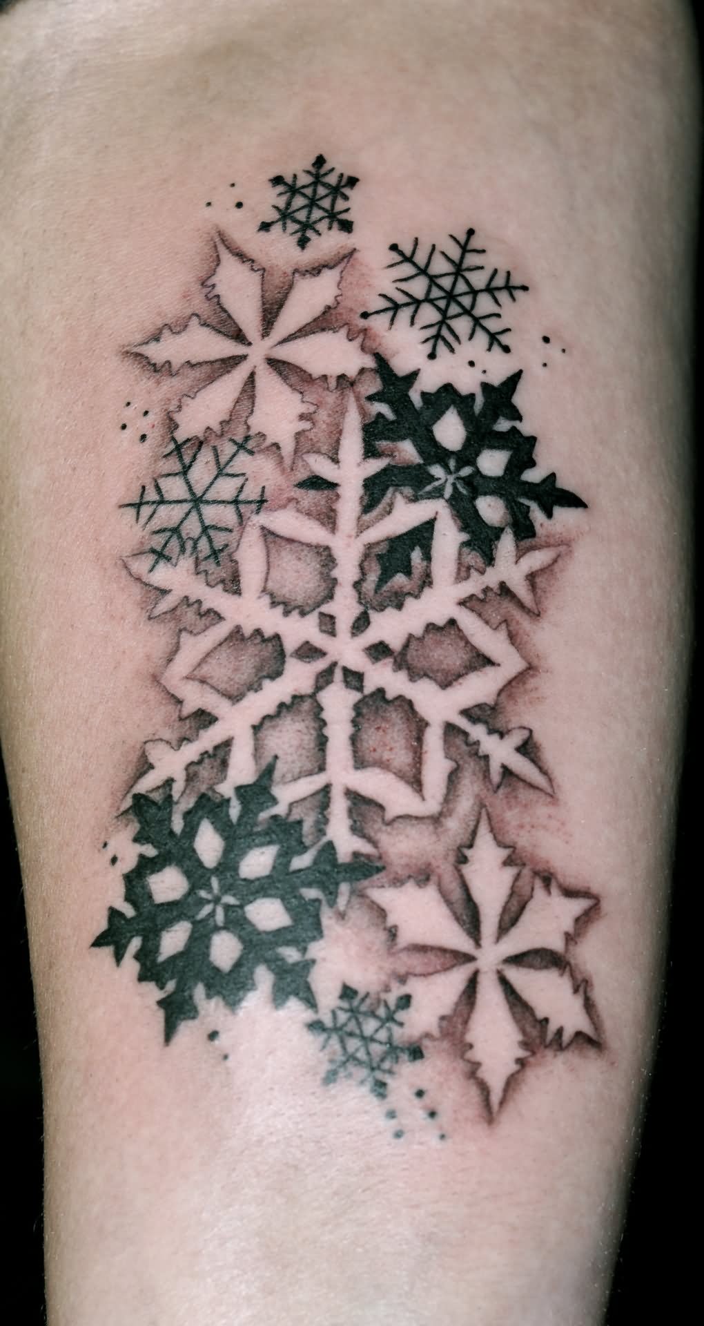 Black & white snowflakes tattoo