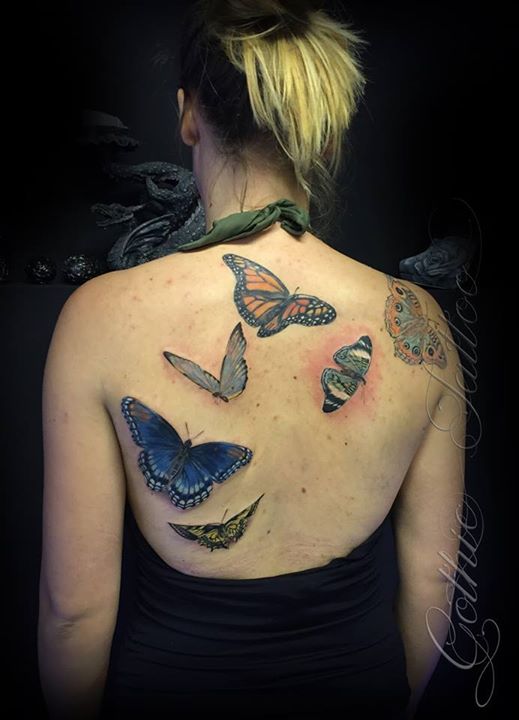 Colorful Flying Butterflies Tattoo on Girl's Back