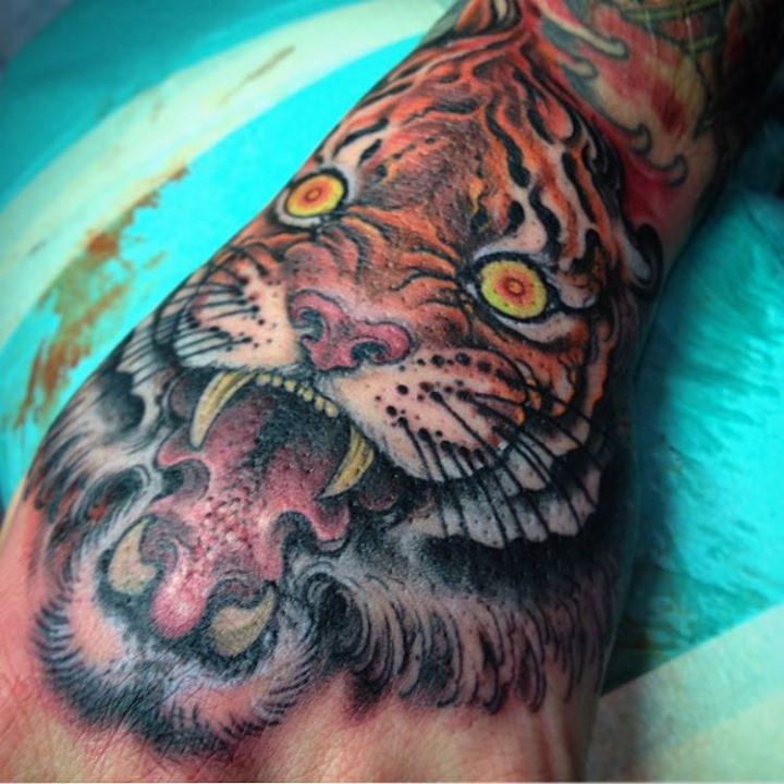 Colorful Roaring Tiger Tattoo on Hand By Jeff gogue