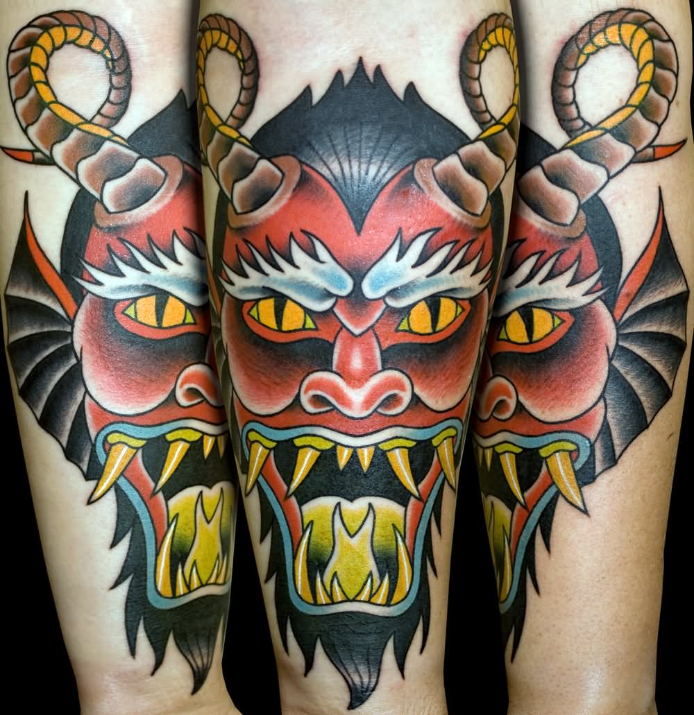 Demon Head tattoo on forearm