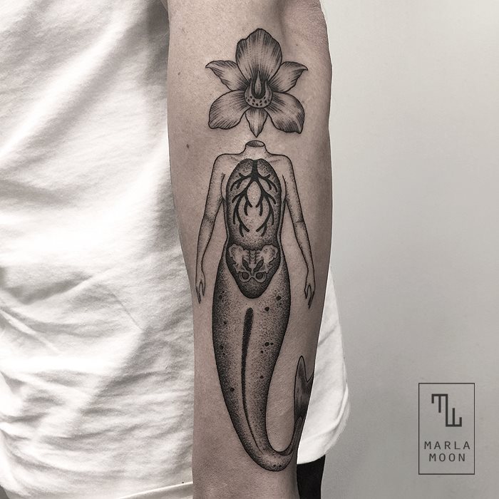 Flower head mermaid tattoo on arm