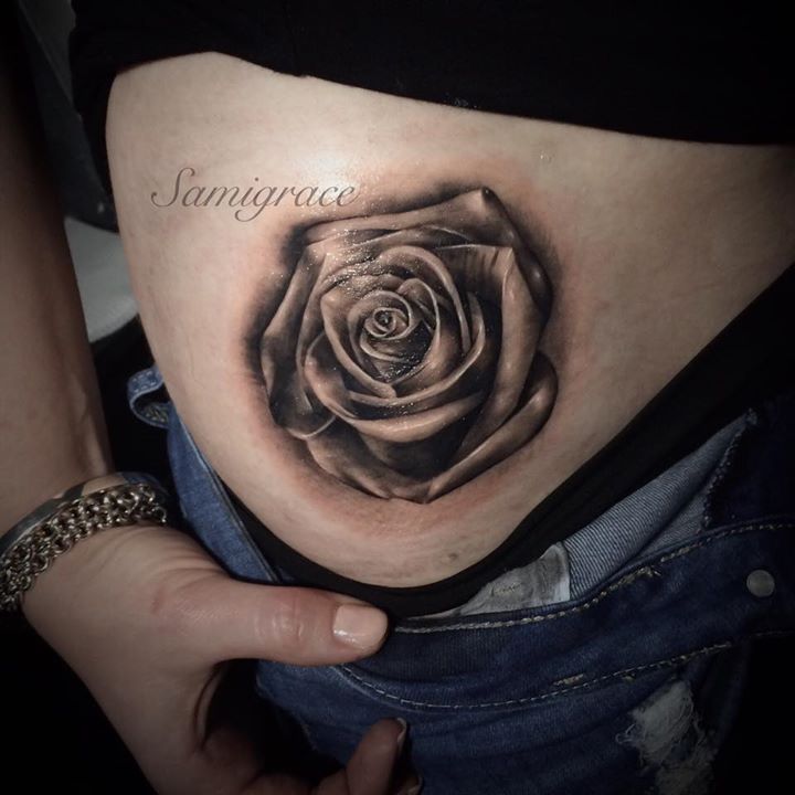 Incredible black rose tattoo on hip