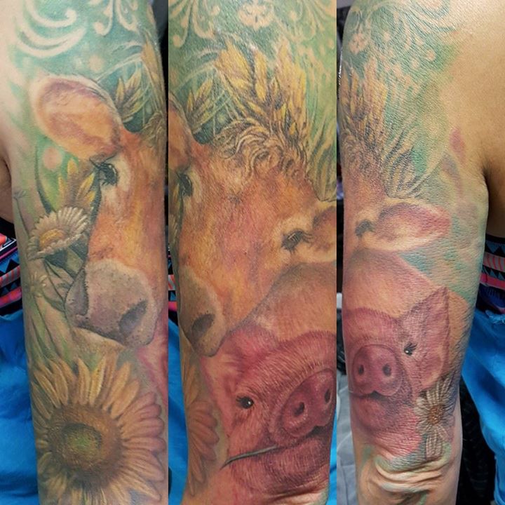 Pig, cow and flowers tattoo on full sleeve