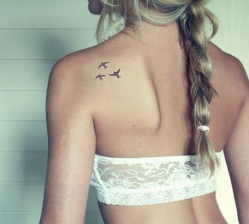 Small black birds tattoo on back shoulder