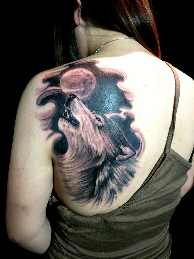 Wolf howling at full moon tattoo on girl's back Shoulder