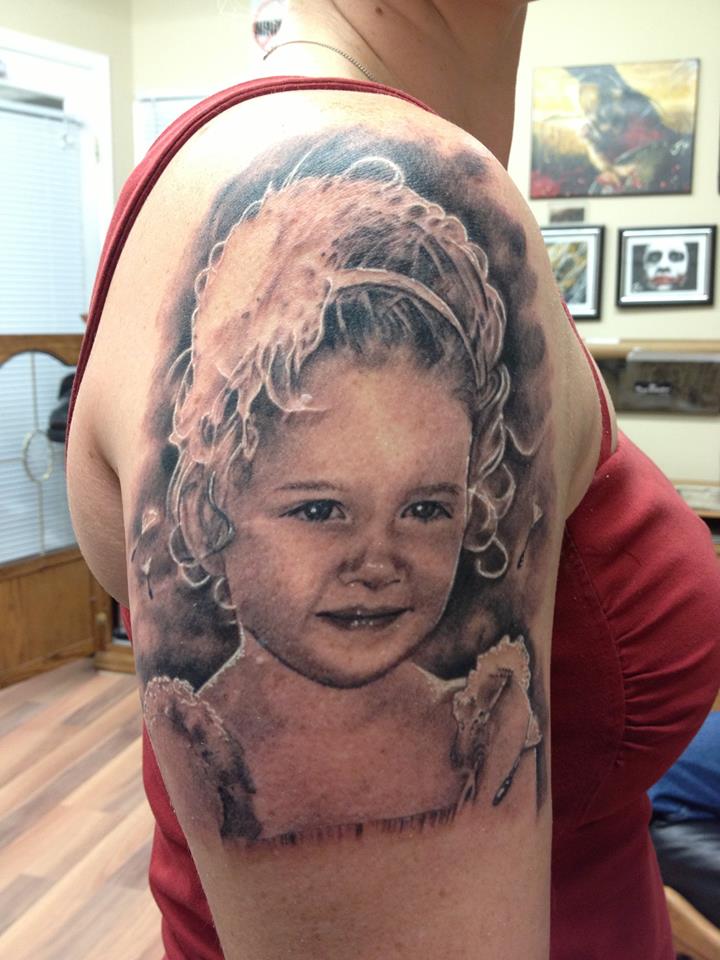 Baby Portrait Tattoo On Right Half Sleeve by Jay French