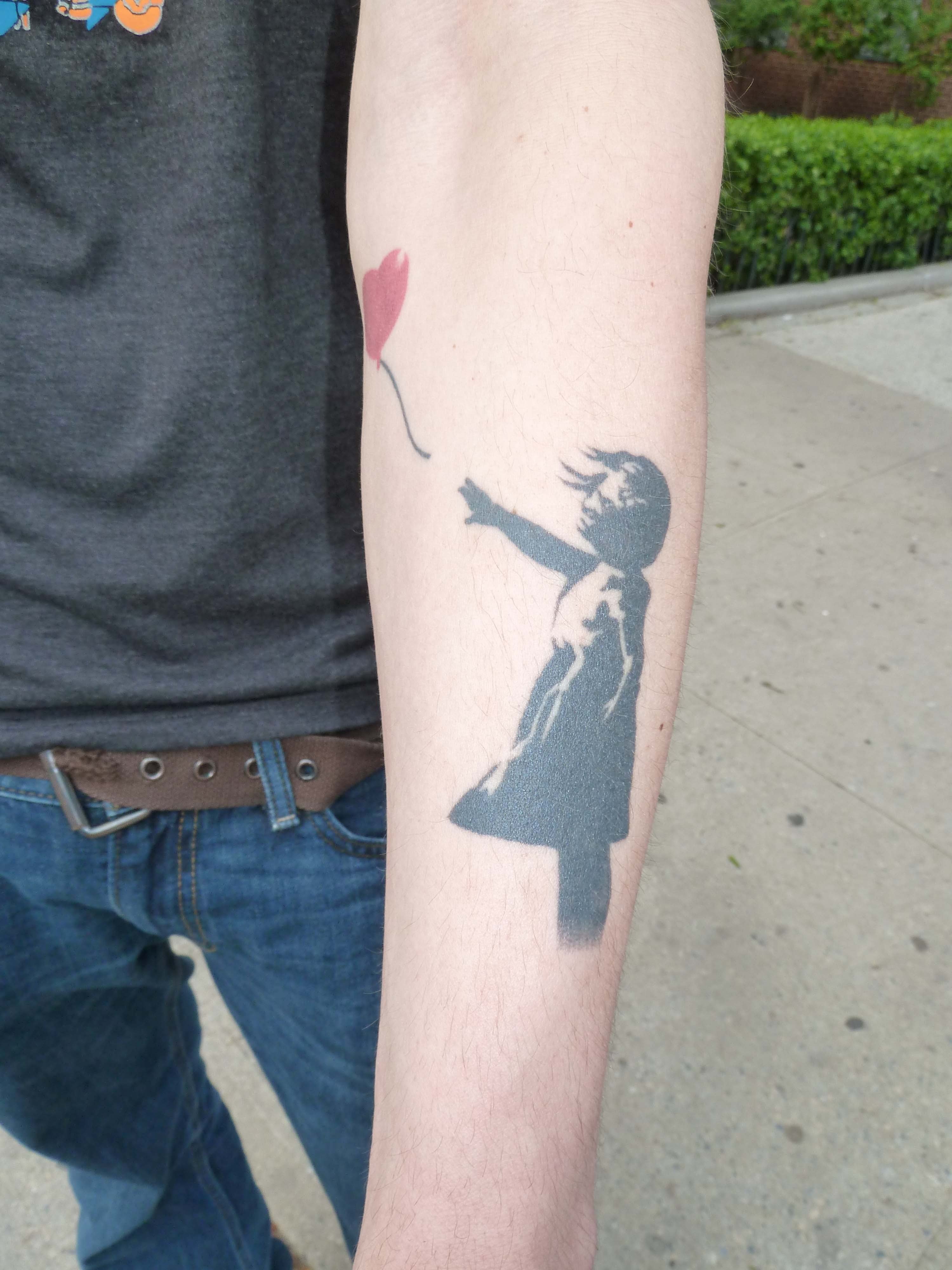 Banksy Girl Tattoo On Guy Left Arm
