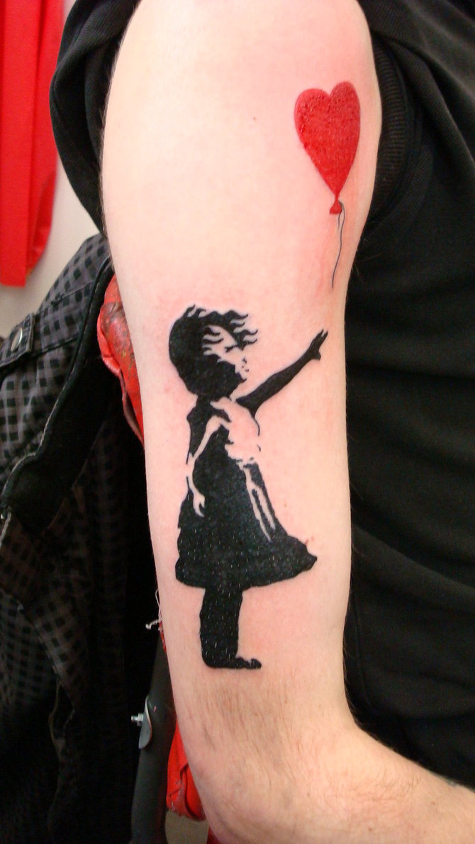 Beautiful banksy girl tattoo on half sleeve