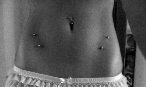 Belly Button And Surface Hip Piercing